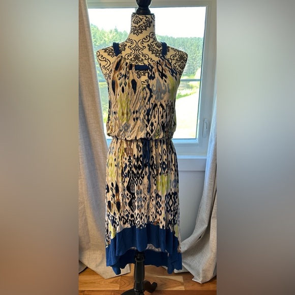 Lightweight material great dress with asymmetrical hemline. Gently used. - Picture 1 of 4